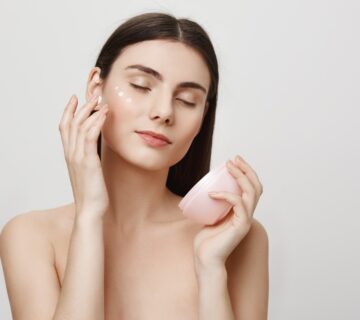 Attractive woman apply facial cream anti aging product 2000px 360x320