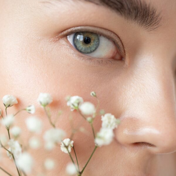 Portrait beautiful woman with clear skin posing with baby s breath flowers 2000px 600x600