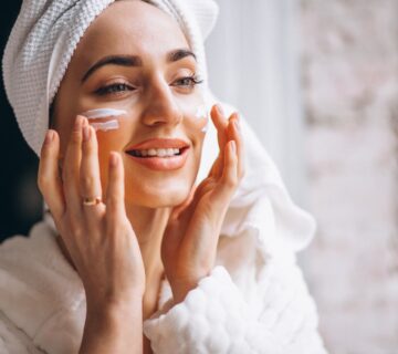 Woman applying face cream 2000px 360x320